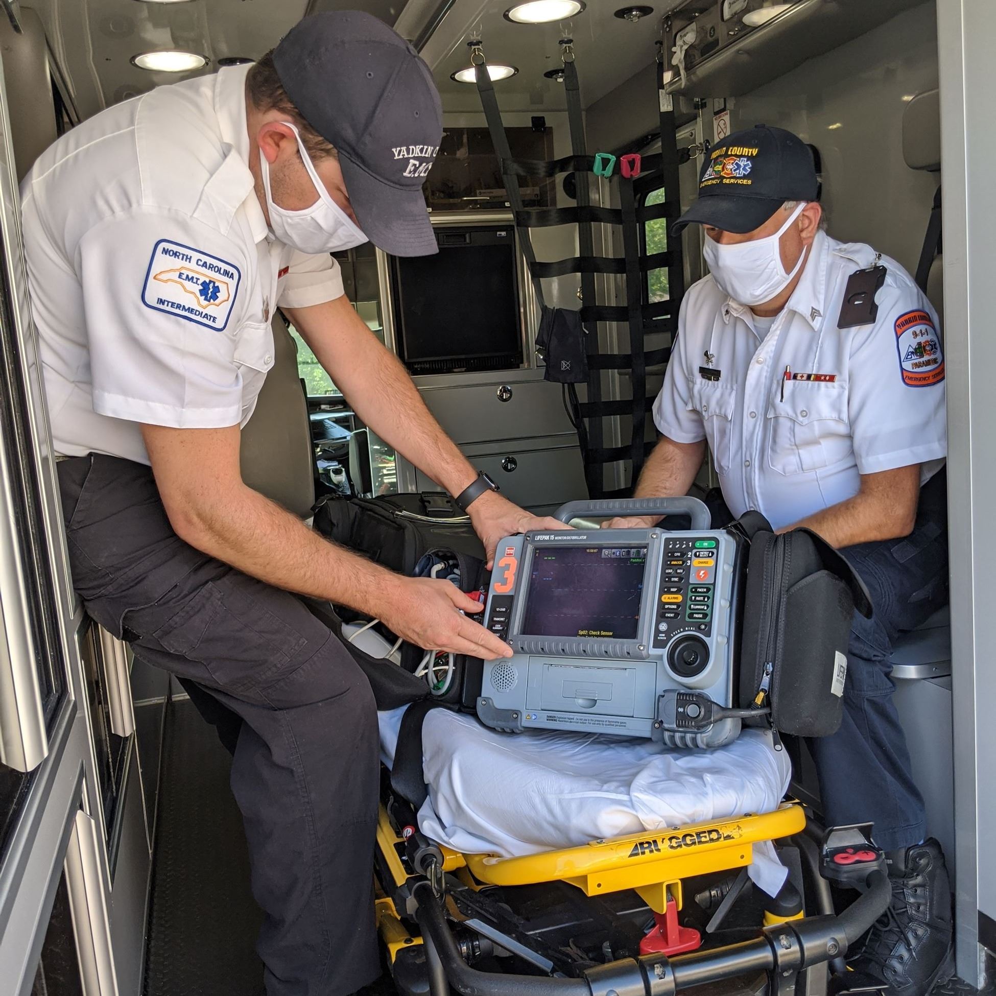 EMS Crew with cardiac monitor 